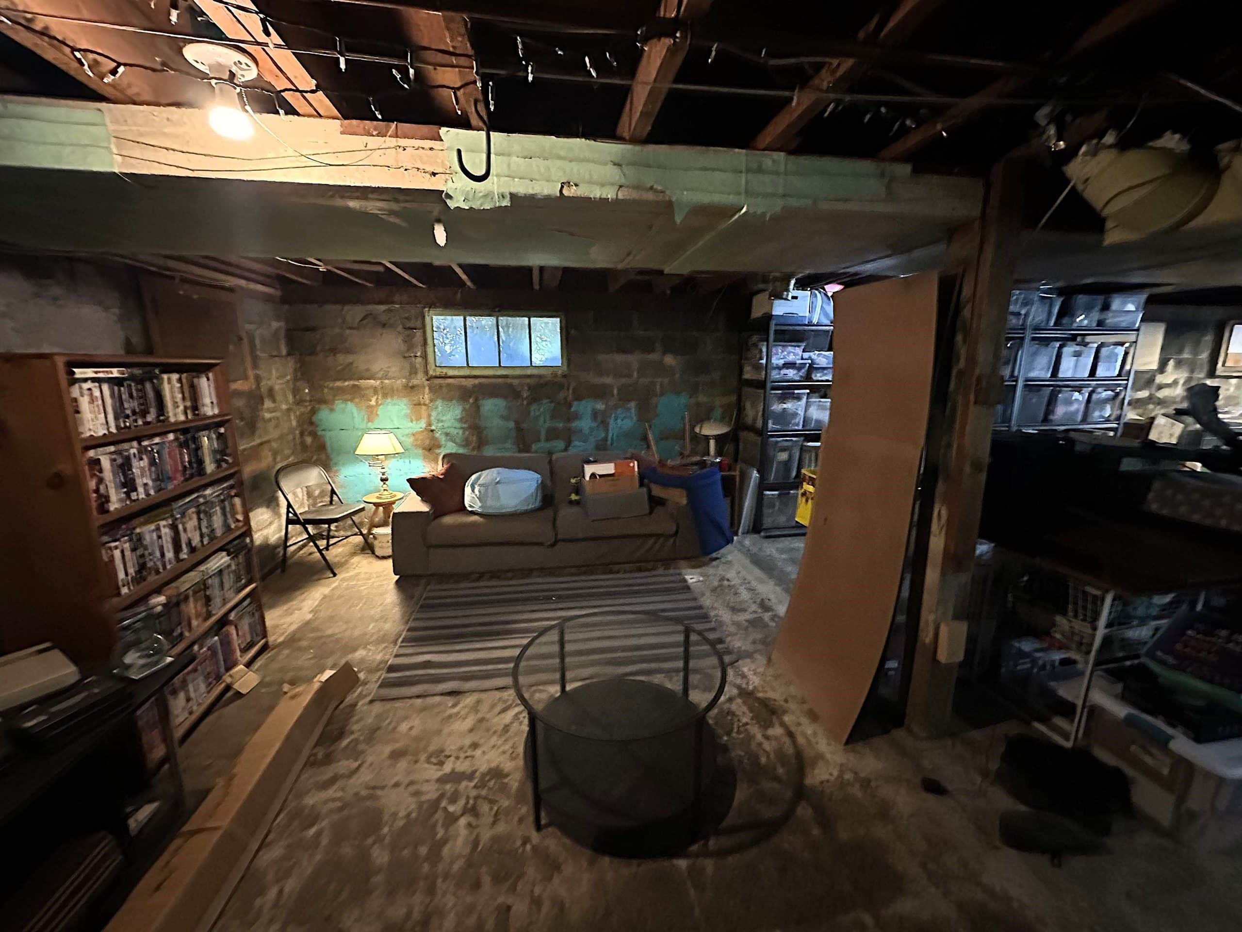 The original lounge area of the basement featured a couch and bookshelf.