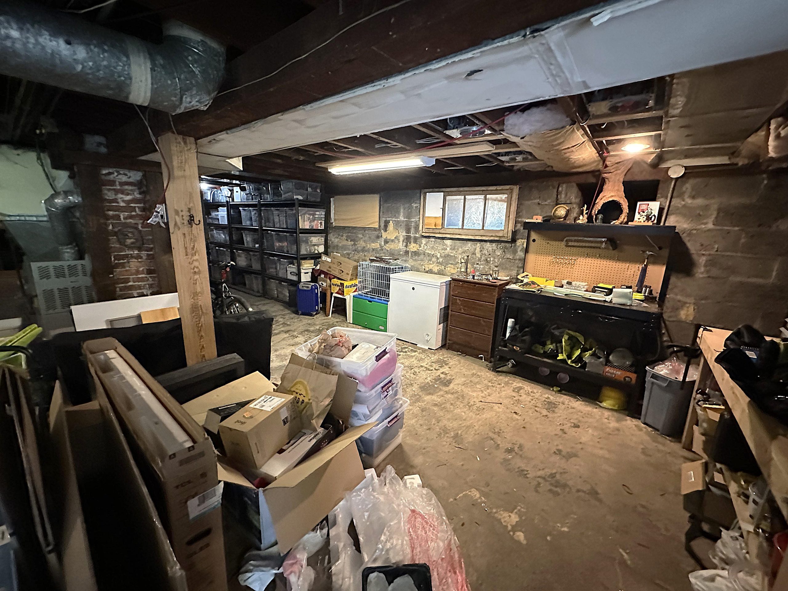 The original basement featured a workbench and ample storage space.