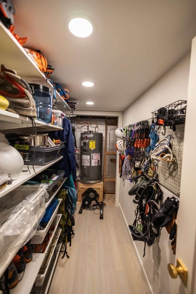 A basement gear storage room was the perfect solution to this adveturous couple's hobby needs.