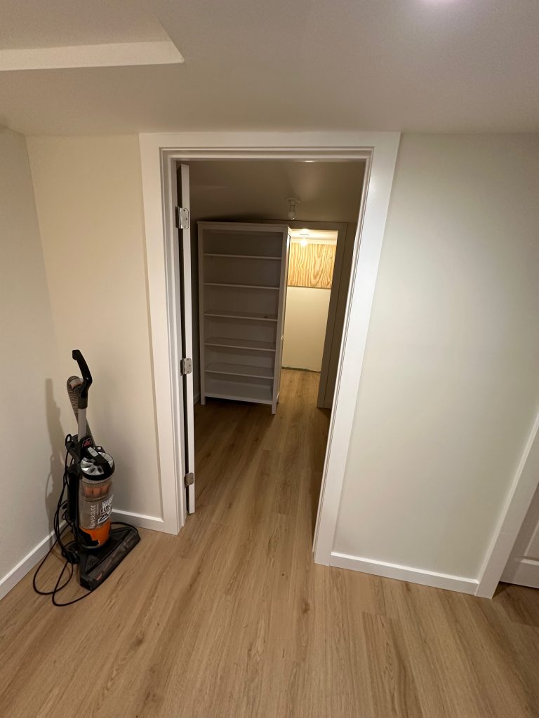 A walk-in in the back of the finished basement provides ample additional storage room.