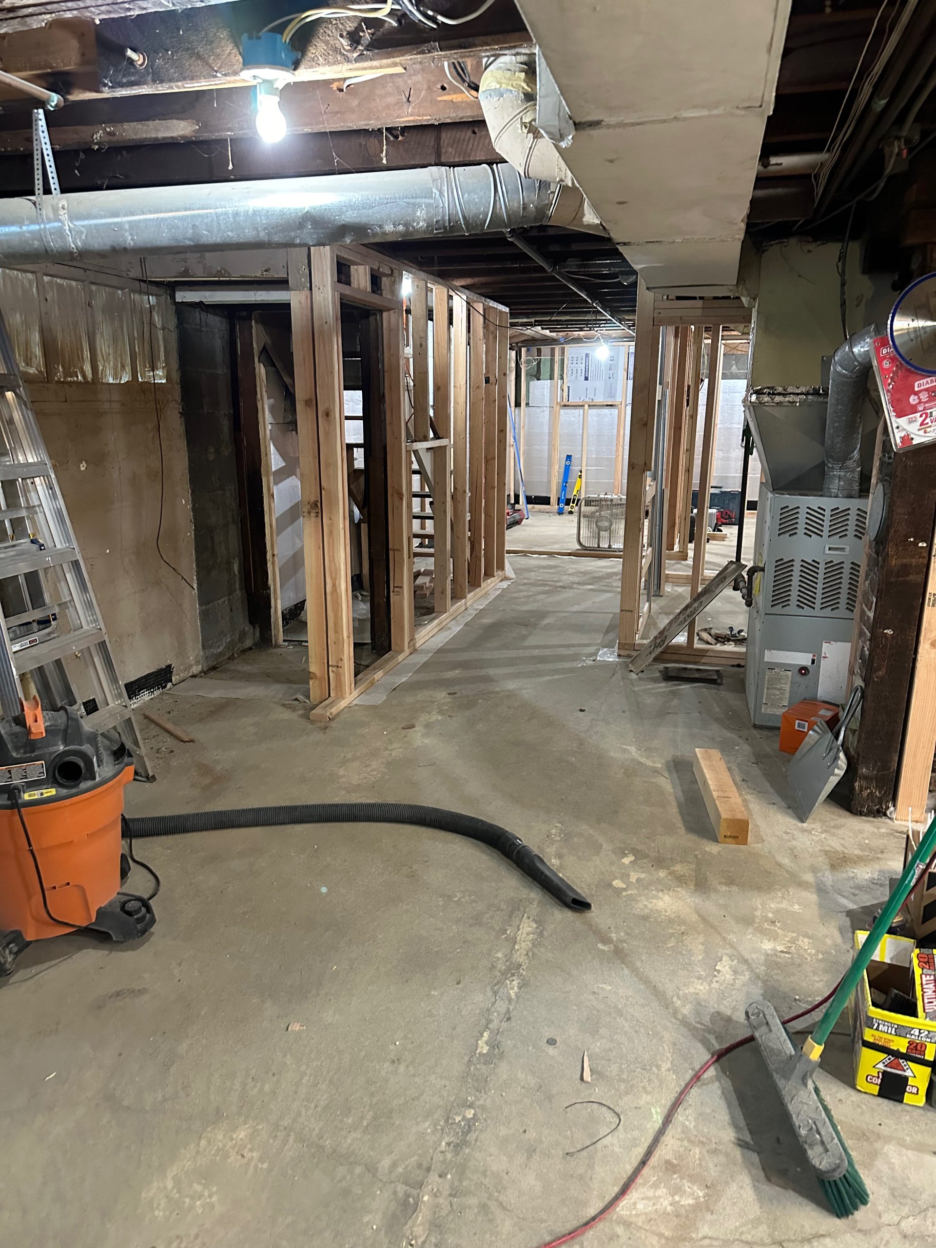 basement conversion process hallway front to back scaled