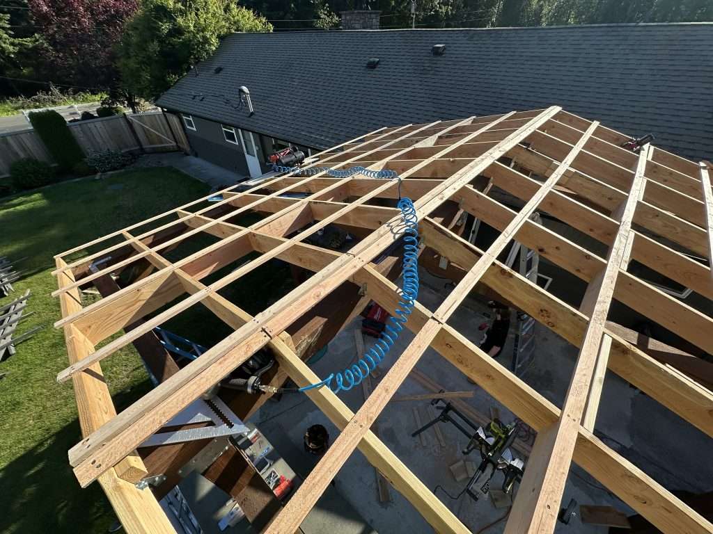 A top view of the roof beams of a wood patio cover.