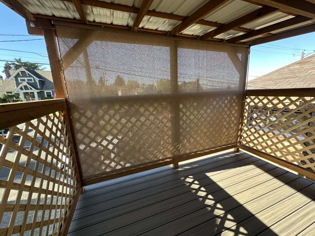 A sun shade keeps the deck cool in summer without completely obstructing the view of Puget Sound.