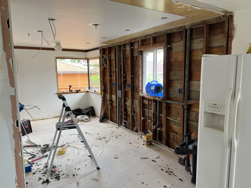 A Seattle kitchen remodel removed all outdated counters and shelves, backsplashes, and flooring.
