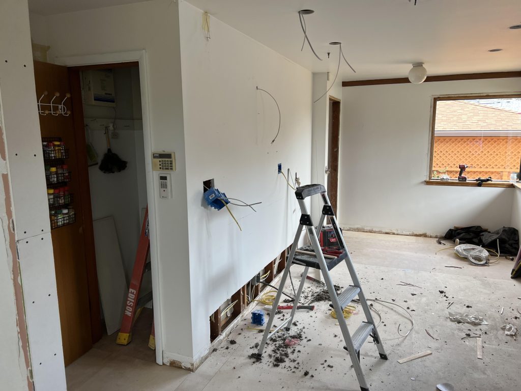 The process of a Seattle kitchen remodel removed the outdated cabinets and flooring.