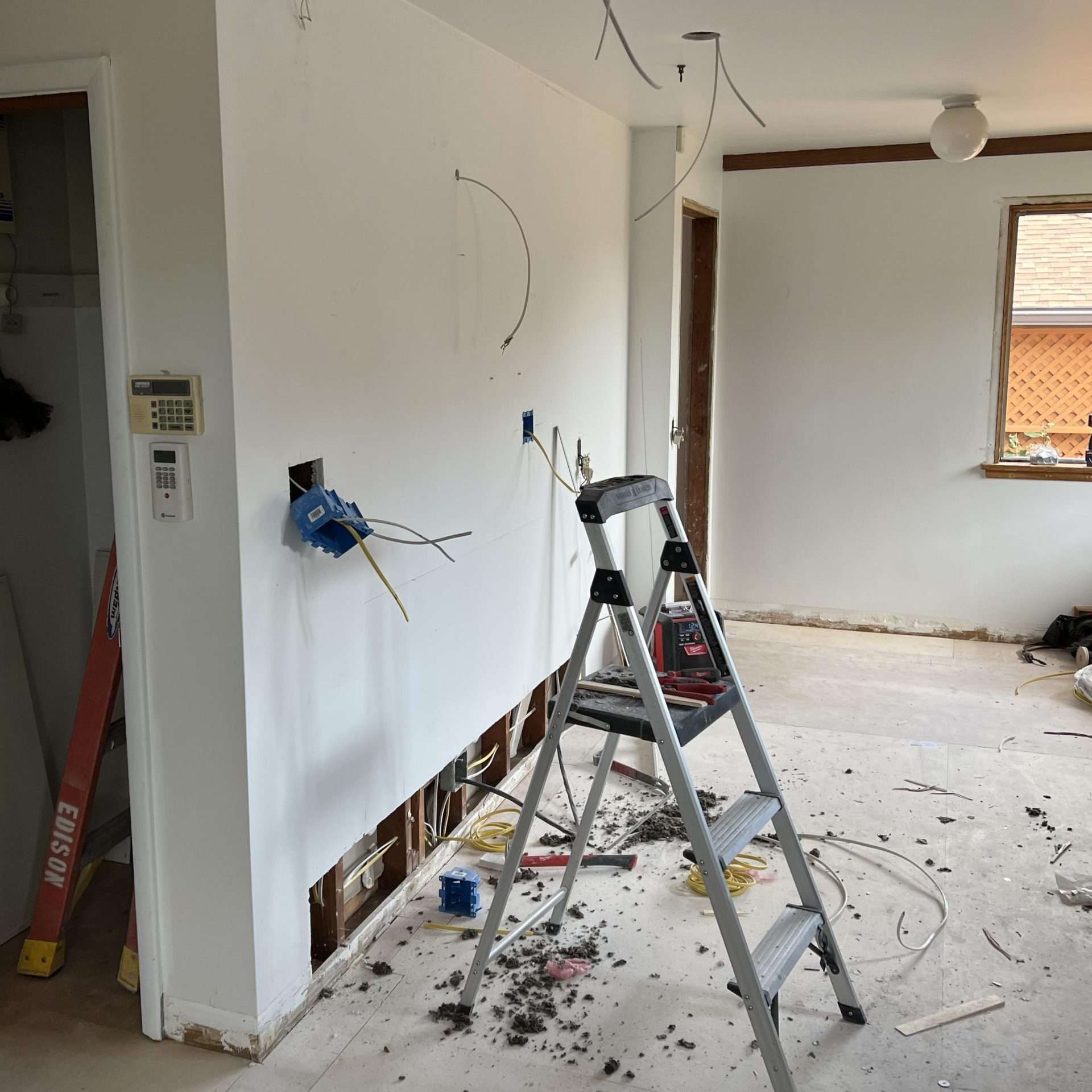 The process of a Seattle kitchen remodel removed the outdated cabinets and flooring.