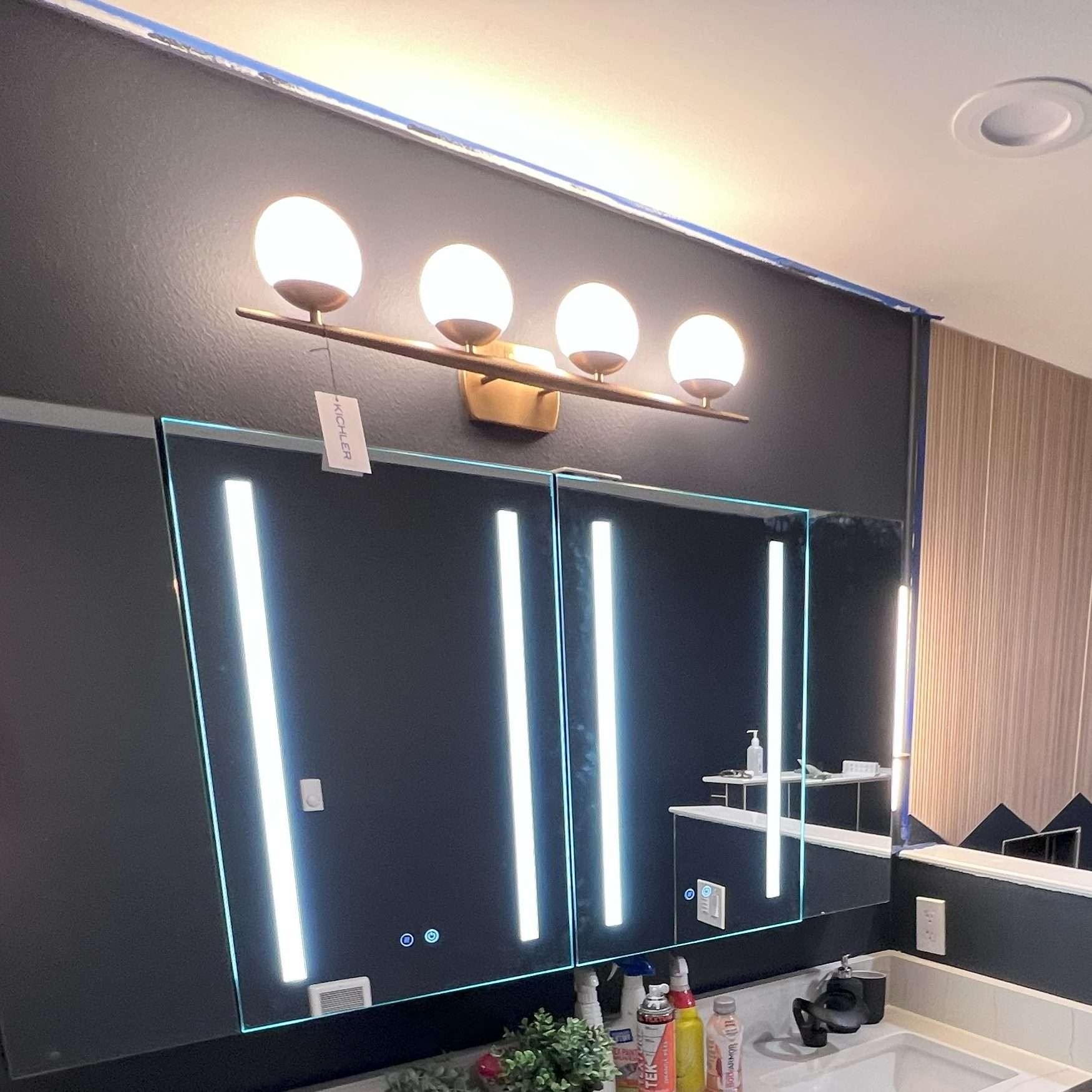 A master bathroom with a double vanity and custom-tiled walk-in shower.