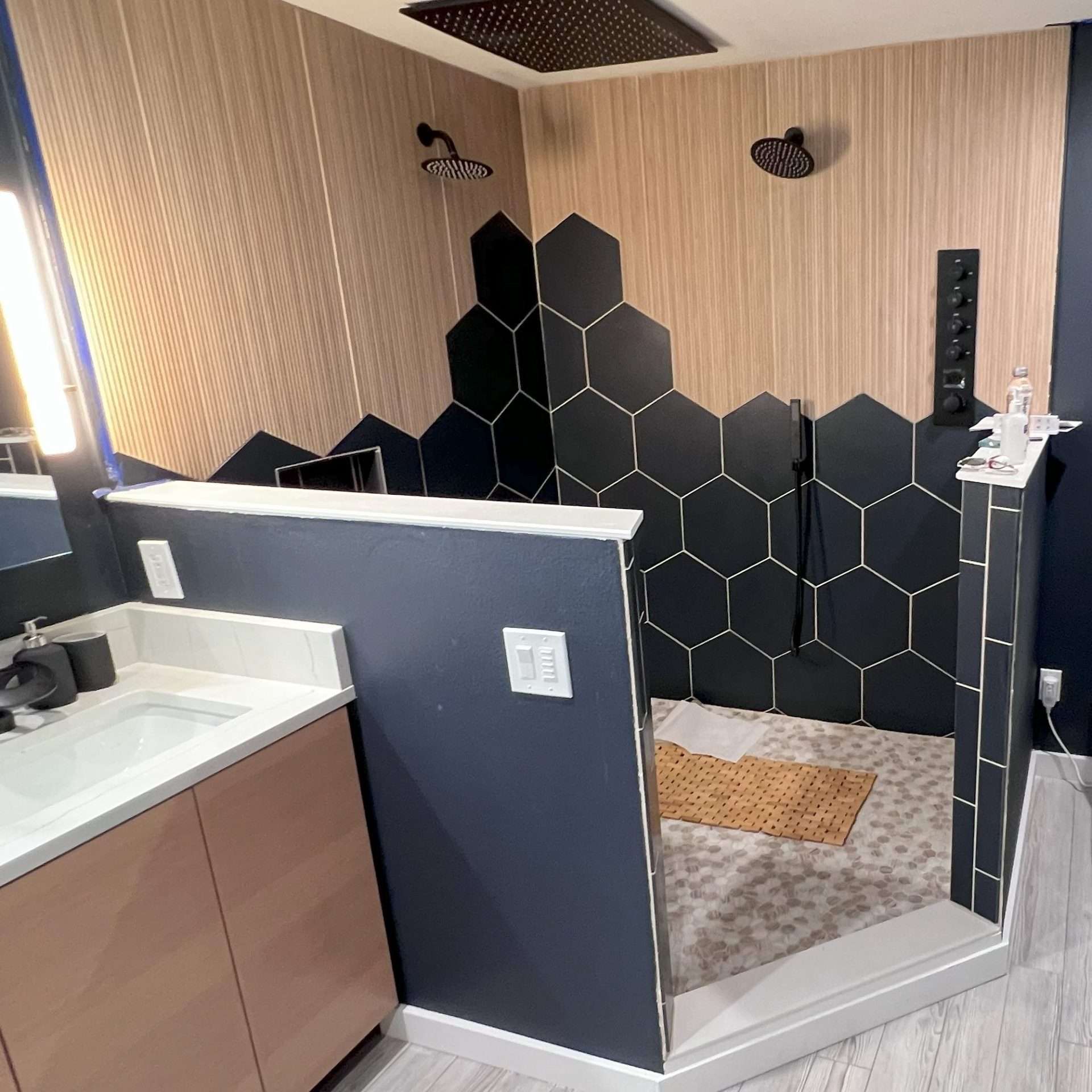 A master bathroom with a bidet toilet, walk-in shower, and vanity.
