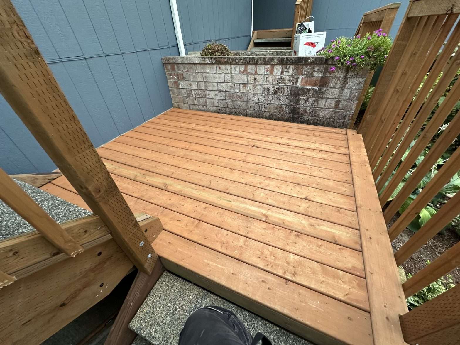 Cedar planks are used to refresh this previously worn entry deck.