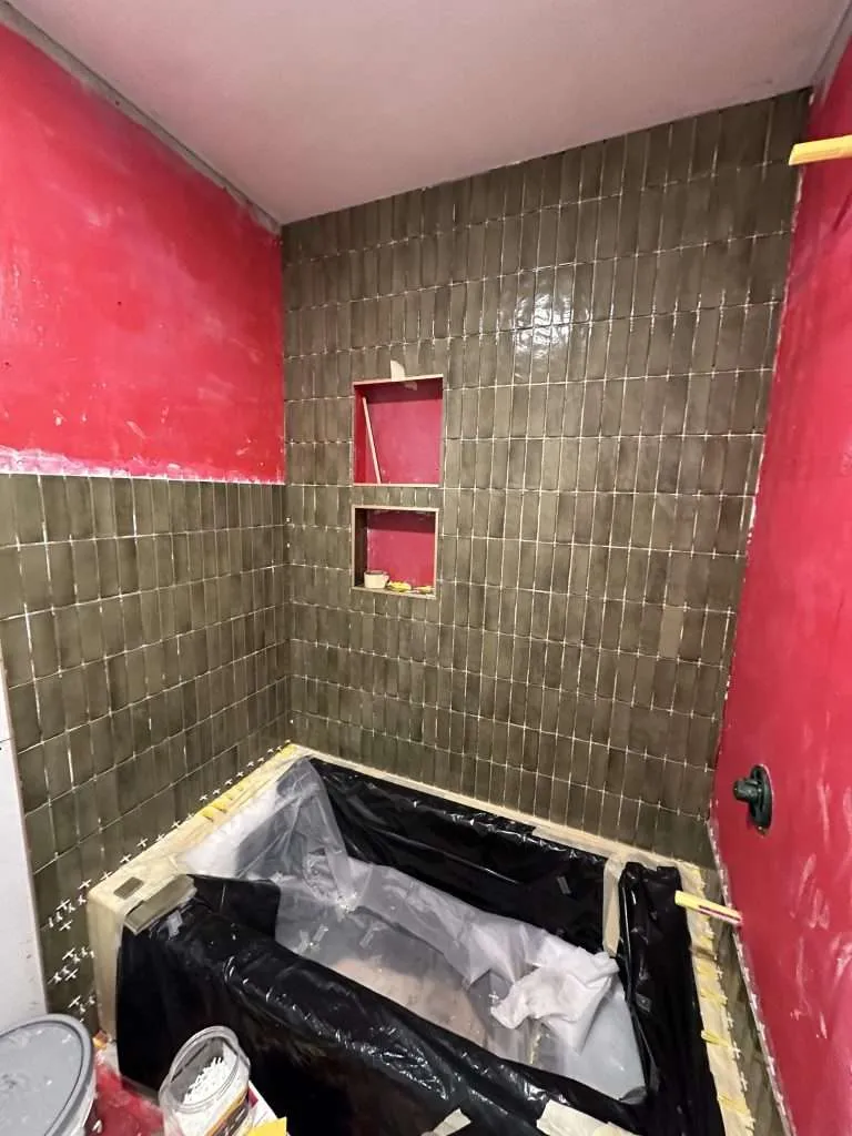 subway style tiles installed for bathtub shower area